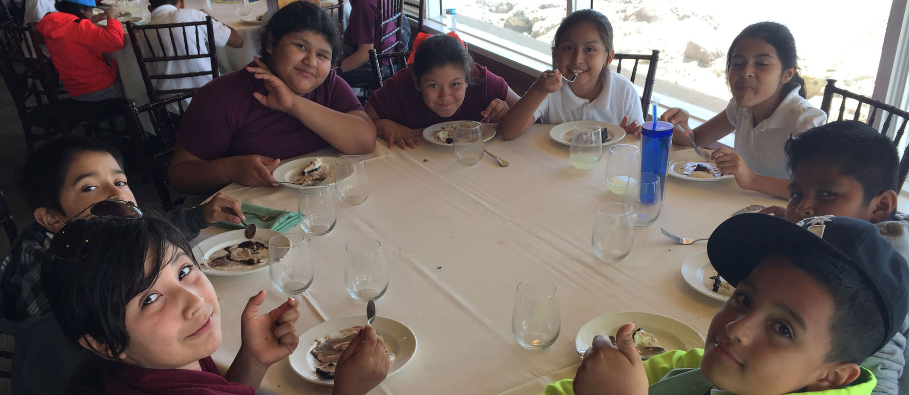 Young students sitting around a table