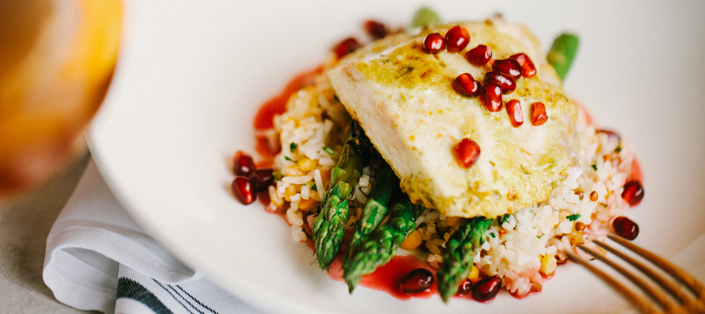 Fish and rice with pomegranate seeds